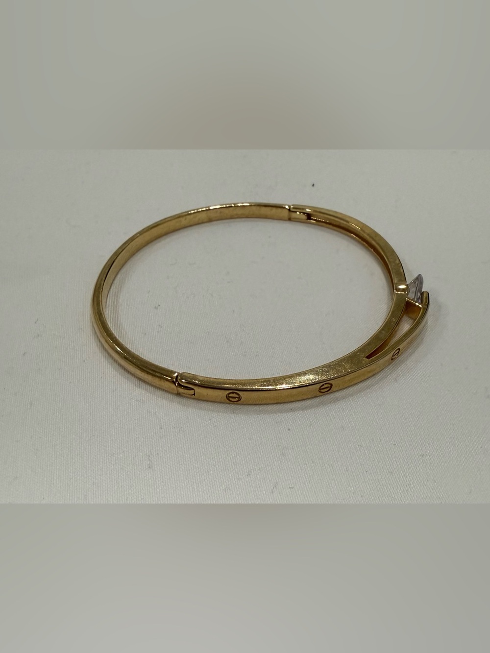 Gold Tone Screw-Accent Hinged Bangle Bracelet